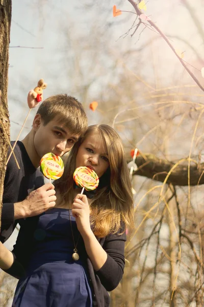 Young couple having covered candy kisses — Stock Photo, Image