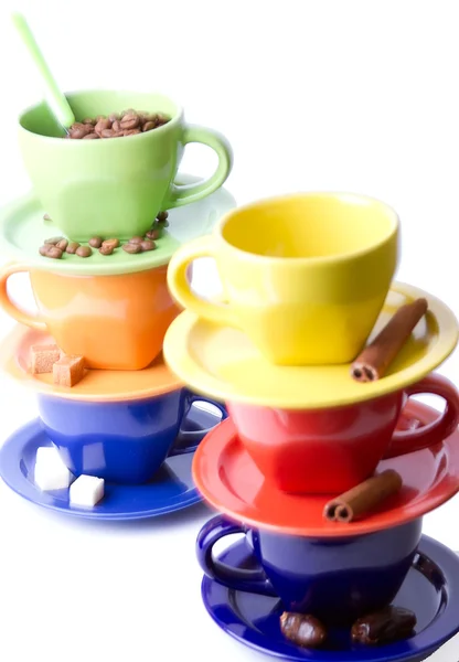 Stock image Multi-colored cups of coffee, sugar and cinnamon stick