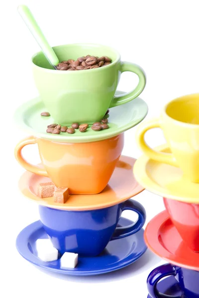 stock image Colorful coffee cups, spoons, sugar and cinnamon stick