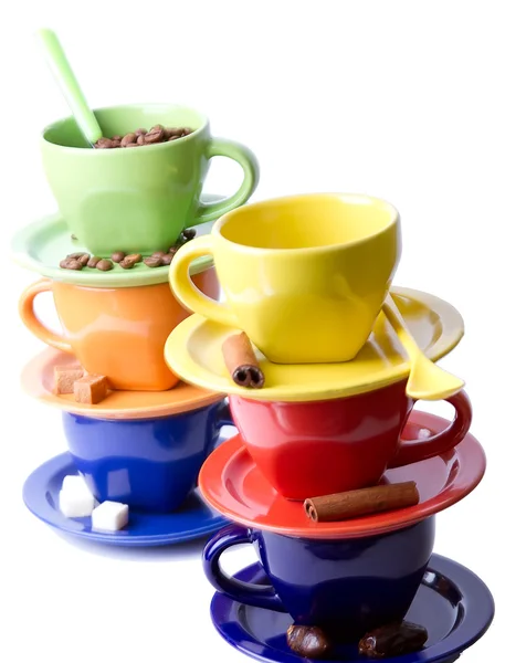 stock image Colored cups of coffee, coffee beans, sugar and cinnamon stick