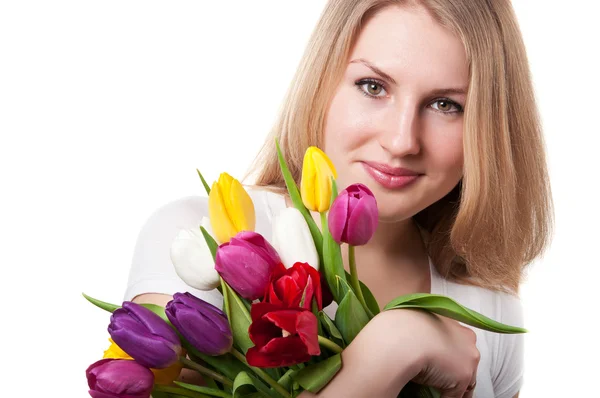 Frau mit Tulpen — Stockfoto