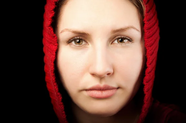 Stock image Portrait of young woman with red hood