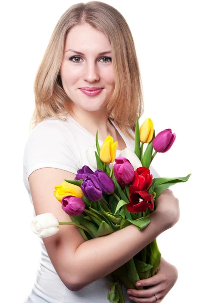 Mujer joven con tulipanes Imagen de stock