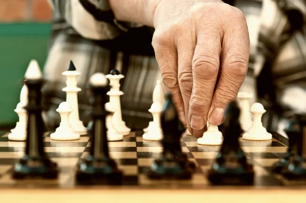 stock image Old man playing chess