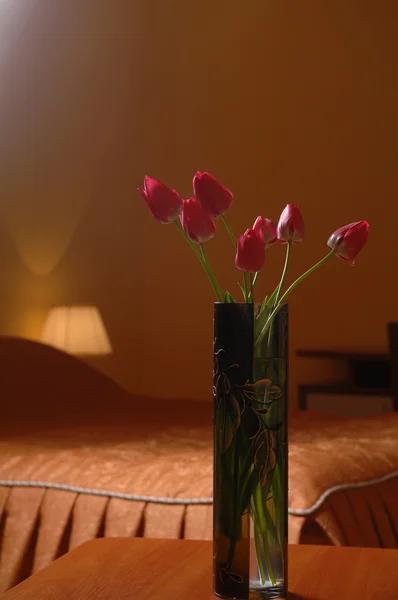 Flowers on a table in the room — Stock Photo, Image
