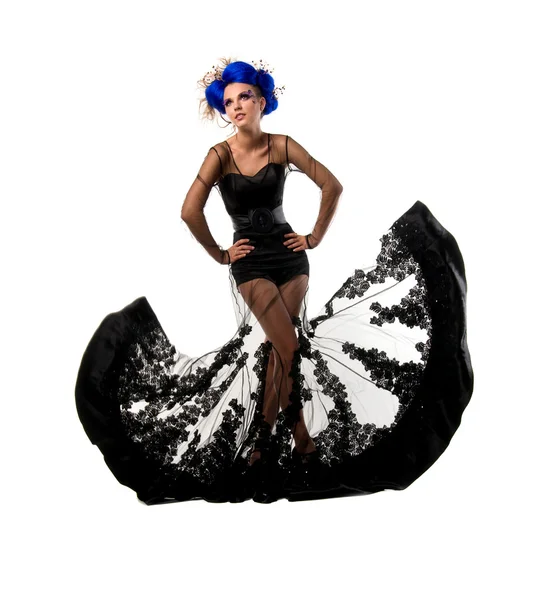 Model in flying a black dress — Stock Photo, Image