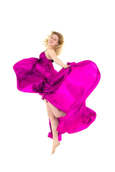 Dancing girl in a pink dress flying — Stock Photo, Image