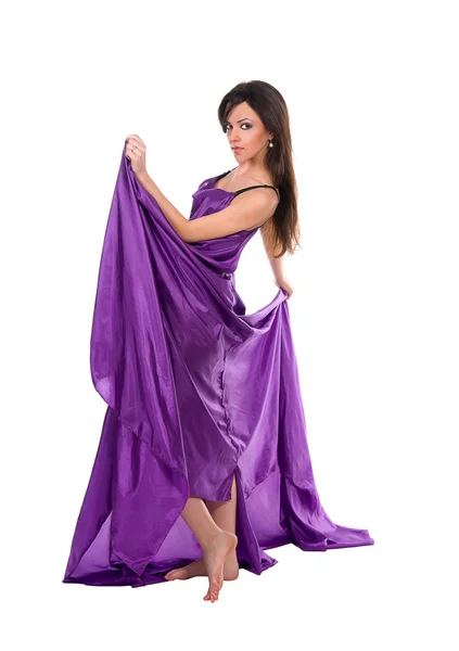 Girl in flying purple silk dress — Stock Photo, Image
