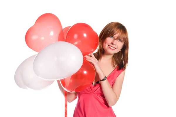Rusovlasá dívka v růžových šatech s balónky — Stock fotografie