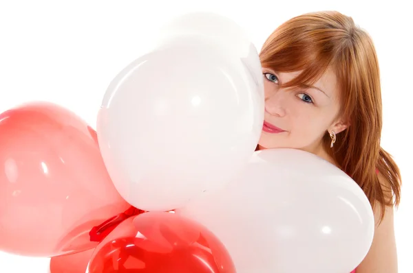 Ragazza dai capelli rossi in un vestito rosa con palloncini — Foto Stock