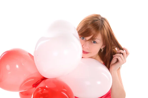 Chica pelirroja en un vestido rosa con globos —  Fotos de Stock