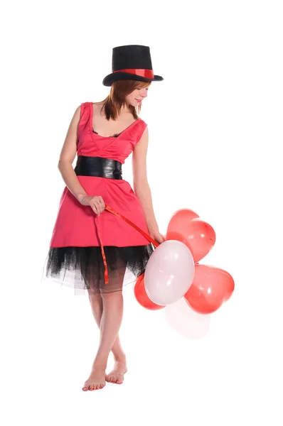 Rudowłosy dziewczyna w kapelusz różowy sukienka i cylindra — Zdjęcie stockowe