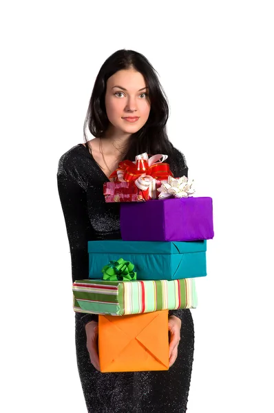 Hermosa chica sosteniendo un montón de cajas con regalos — Foto de Stock