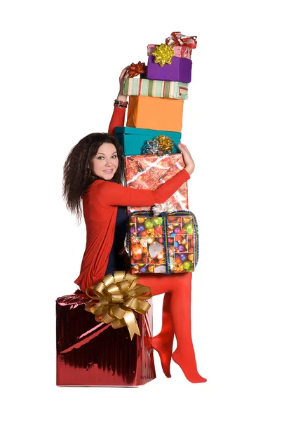 Vacker flicka som håller en hel del lådor med gåvor — Stockfoto