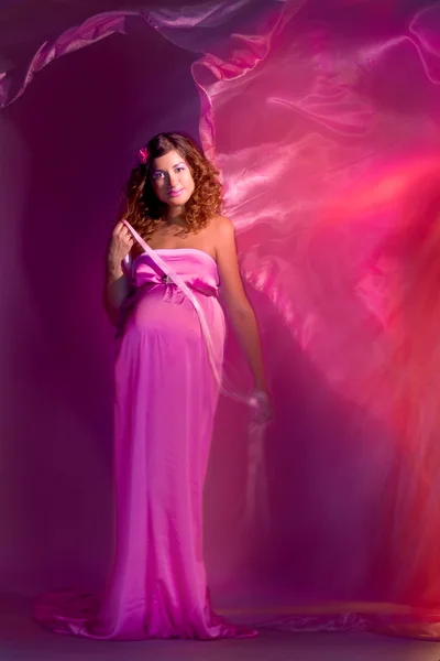 Pregnant girl with flying dress — Stock Photo, Image