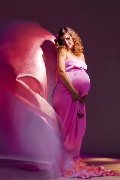Pregnant girl with flying dress — Stock Photo, Image