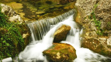 Cataracts of the torrent of The Garriga clipart