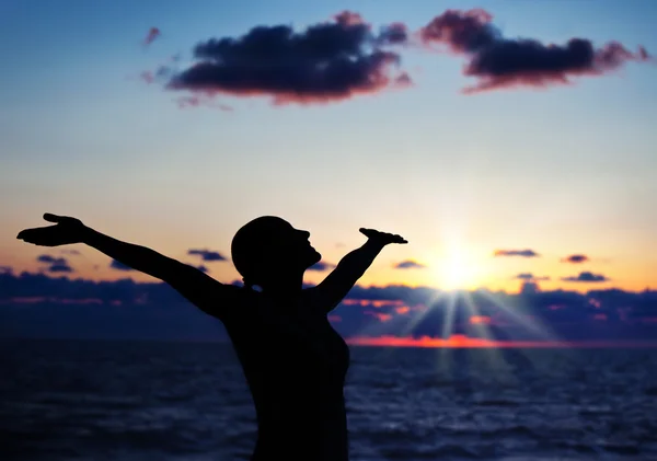 Woman silhouette over sunset — Stock Photo, Image