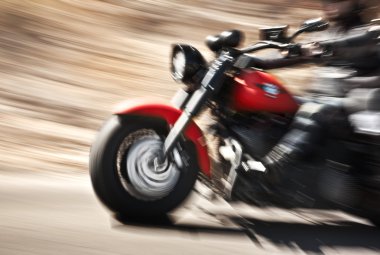 Abstract slow motion, biker riding motorbike clipart