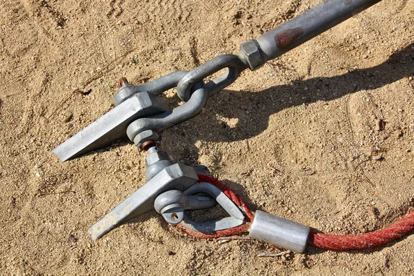 Cable anchors into the ground — Stock Photo, Image