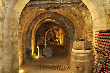 Filling the cellar caves beneath the city of Aranda de Duero Spa clipart
