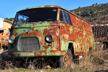 Old green van abandoned old rusty clipart