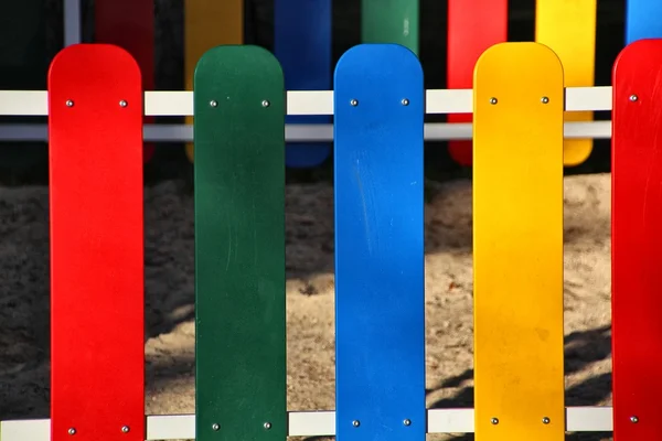 stock image Wooden fence painted in bright colors