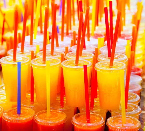Colorful natural fresh fruits juice glasses with straw — Stock Photo, Image