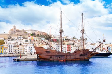 Eivissa ibiza town with old classic wooden boat clipart