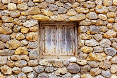 Masonry stone wall with grunge wood window clipart