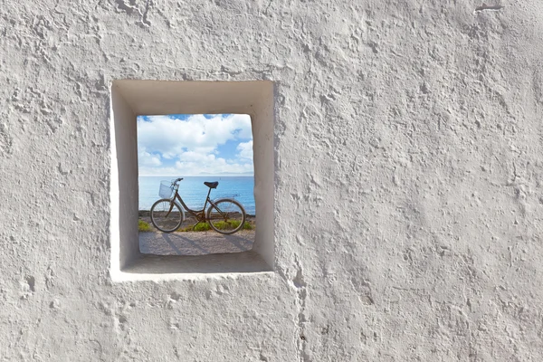 Balearic islands beach and bicycle through window — Stock Photo, Image