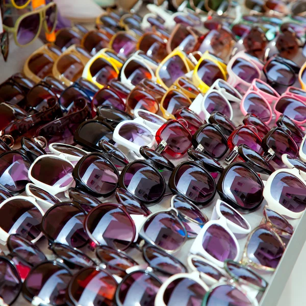 Fashion sunglasses rows in outdoor shop display — Stock Photo, Image