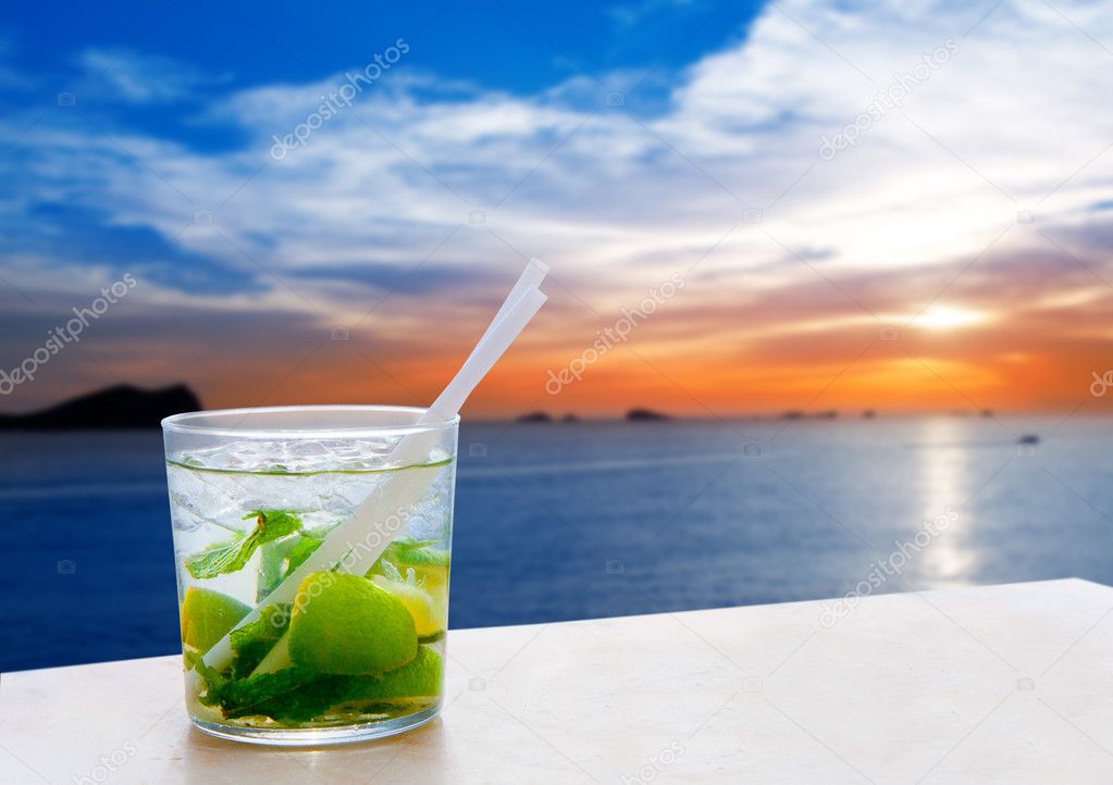 Ibiza cala Conta Conmte sunset with Mojito drink