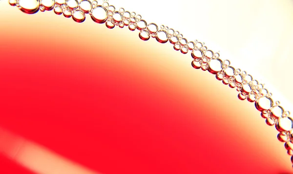 Červené pozadí s bublinami — Stock fotografie