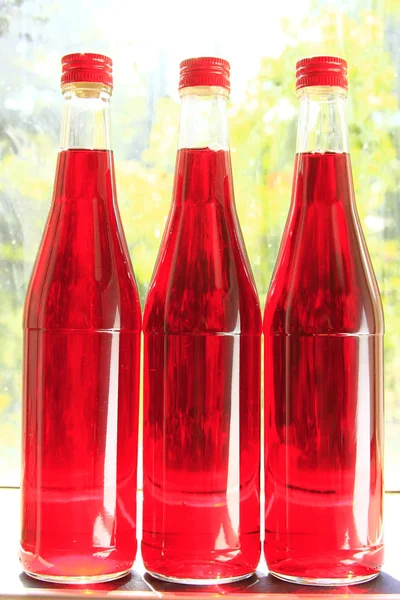 Three bottles of fruit wine — Stock Photo, Image