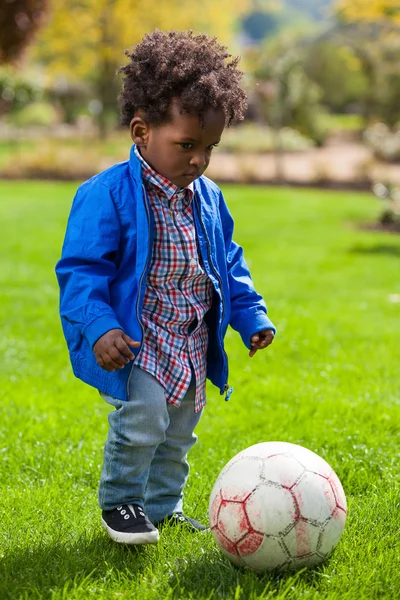 stock image Outdoor portrait of a black baby playing soccer