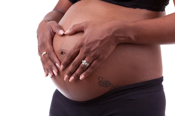 Junge schwangere indische Frau berührt ihren Bauch — Stockfoto