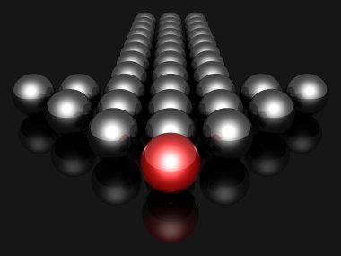 Balls forming an arrow.with red leader on dark background clipart