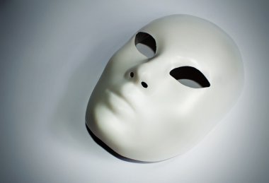 Dramatic theatre concept with the white plastic mask clipart