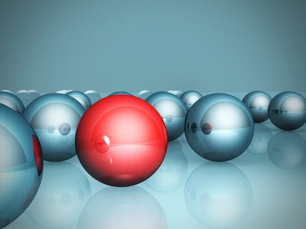 Один червоний унікальний окремий м'яч у блакитній групі — стокове фото