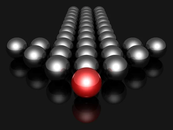Balls forming an arrow.with red leader on dark background — Stock Photo, Image