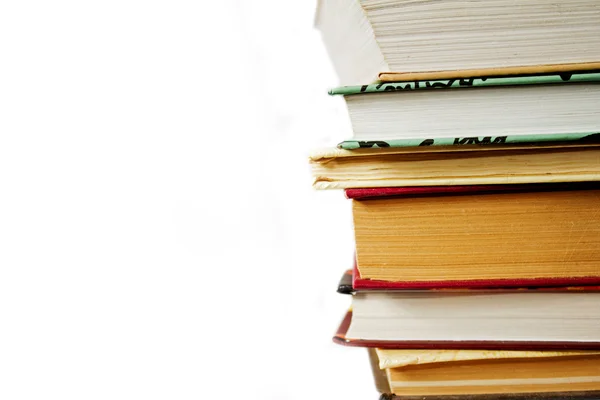 Hoge boeken stapel als kennis concept op witte achtergrond — Stockfoto