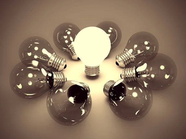 Ideia conceito de uma lâmpada brilhante no escuro — Fotografia de Stock