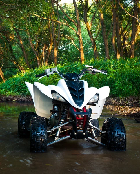 ATV in water — Stockfoto