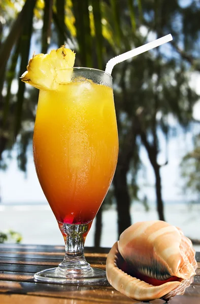 Fresh fruit cocktail with ocean background