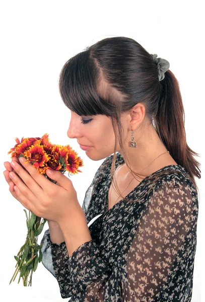 stock image The girl with a bunch of flowers.