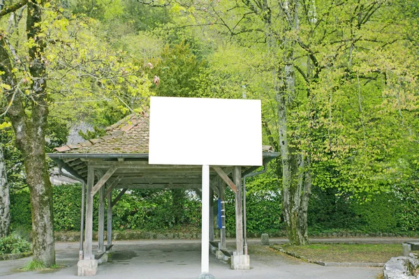 Billboard in a public park background — Stock Photo, Image