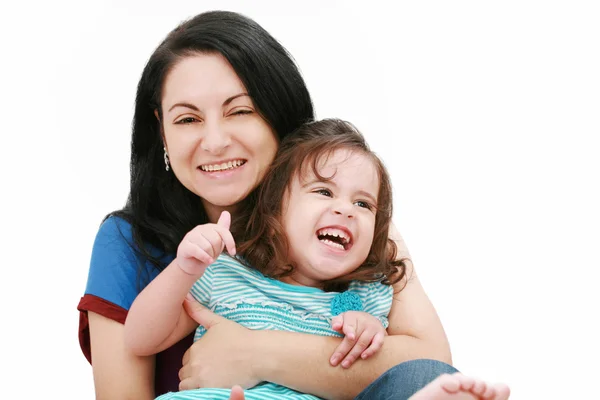 Close-up van gelukkige jonge moeder met plezier met haar dochter — Stockfoto