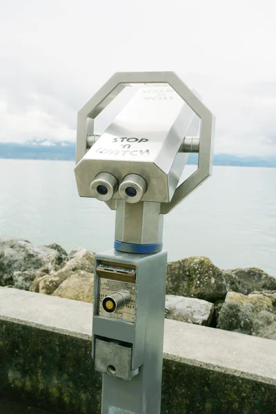 Silver coin operated pay binoculars — Stock Photo, Image