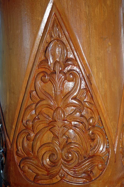 Brown wood carvings on the pole — Stock Photo, Image